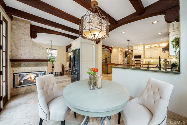 Chandelier, Dining room, Fireplace, Interior, Kitchen, Pendant Lights, Recessed Lighting, Stainless Steel Appliances, Stone Walls, Wooden Beams