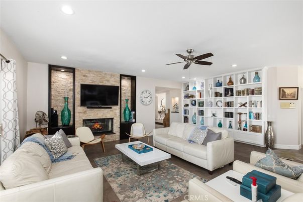 Fireplace, Interior, Living room, Recessed Lighting, Stone Walls, Wood Texture Flooring