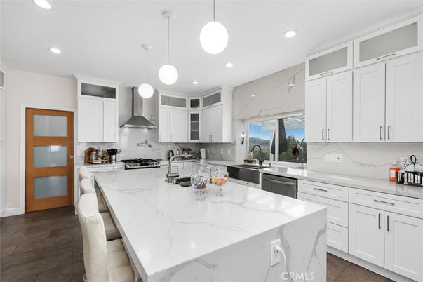 Interior, Kitchen, Marble Walls, Pendant Lights, Recessed Lighting, Stainless Steel Appliances