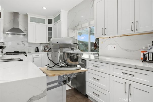 Interior, Kitchen, Marble Walls, Recessed Lighting, Stainless Steel Appliances