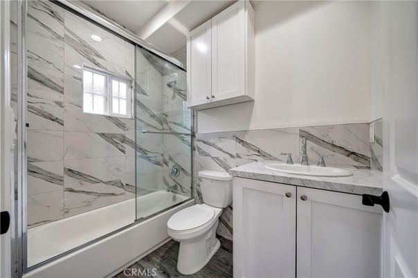Bathroom, Glass Shower, Interior, Marble Walls, Recessed Lighting, Wood Texture Flooring