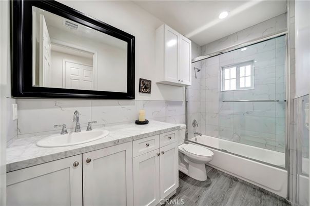 Bathroom, Glass Shower, Interior, Marble Walls, Recessed Lighting, Wood Texture Flooring