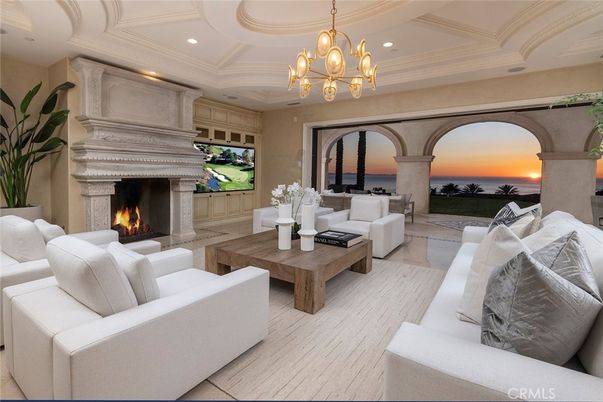 Chandelier, Fireplace, Interior, Living room, Recessed Lighting, Water, Wood Texture Flooring