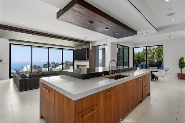Dining room, Fireplace, Interior, Kitchen, Living room, Pendant Lights, Recessed Lighting, Stainless Steel Appliances, Water, Wooden Ceilings
