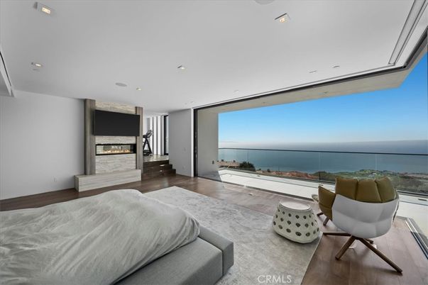 Bedroom, Fireplace, Interior, Recessed Lighting, Water, Wood Texture Flooring