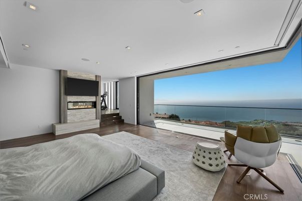 Bedroom, Fireplace, Interior, Recessed Lighting, Water, Wood Texture Flooring