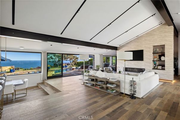 Fireplace, Interior, Living room, Recessed Lighting, Stone Walls, Water, Wood Texture Flooring