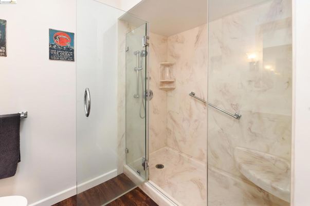 Bathroom, Glass Shower, Interior, Marble Walls, Wood Texture Flooring