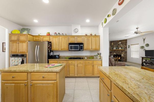 Fireplace, Interior, Kitchen, Recessed Lighting, Stainless Steel Appliances, Stone Walls