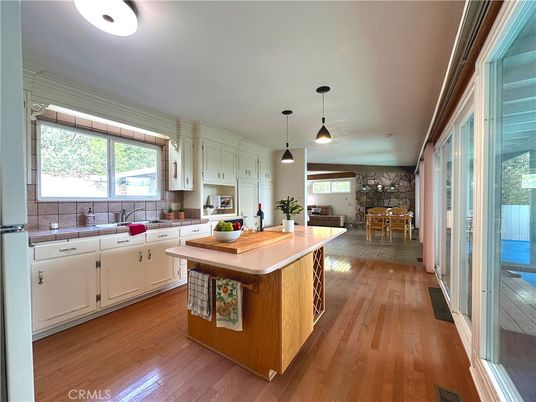Dining room, Interior, Kitchen, Pendant Lights, Stone Walls, Tile Countertops, Wood Texture Flooring