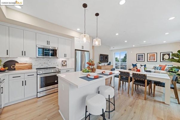 Dining room, Interior, Kitchen, Living room, Pendant Lights, Recessed Lighting, Stainless Steel Appliances, Wood Texture Flooring