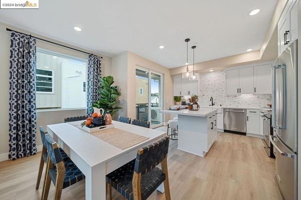 Dining room, Interior, Kitchen, Pendant Lights, Recessed Lighting, Stainless Steel Appliances, Wood Texture Flooring