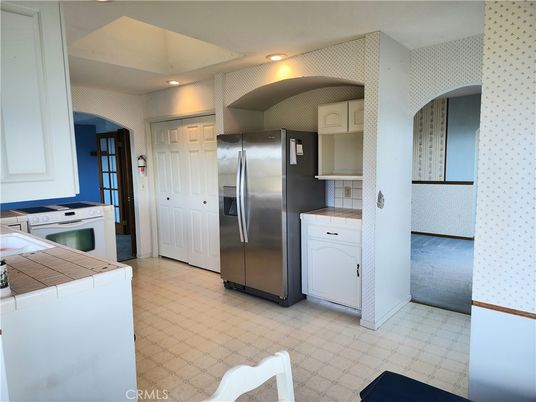 Interior, Kitchen, Recessed Lighting, Tile Countertops, Washer
