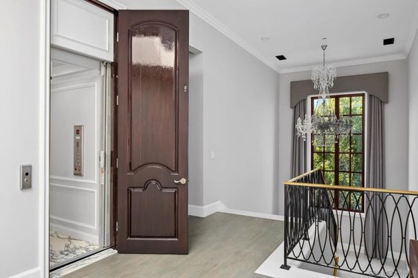 Chandelier, Elevator, Interior, Recessed Lighting, Wood Texture Flooring