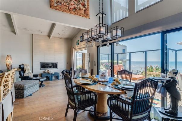 Dining room, Fireplace, Interior, Living room, Pendant Lights, Water, Wood Texture Flooring