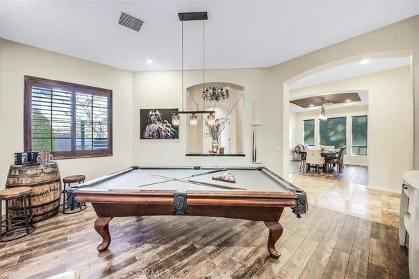Billiard Table, Chandelier, Dining room, Game Room, Interior, Pendant Lights, Recessed Lighting, Wood Texture Flooring