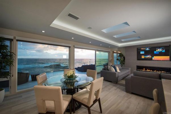 Dining room, Fireplace, Interior, Living room, Recessed Lighting, Water, Wood Texture Flooring