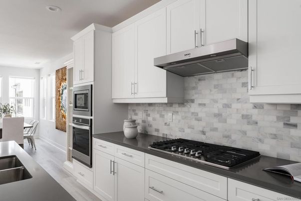 Dining room, Interior, Kitchen, Recessed Lighting, Stainless Steel Appliances, Wood Texture Flooring