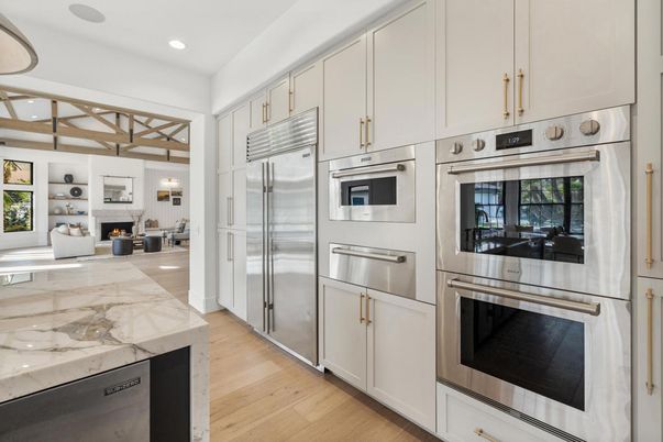 Fireplace, Interior, Kitchen, Recessed Lighting, Stainless Steel Appliances, Wood Texture Flooring