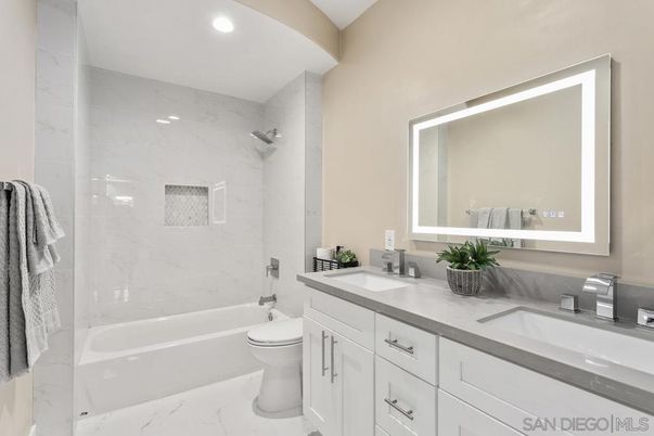 Bathroom, Dual Sink Vanities, Interior, Marble, Marble Walls, Recessed Lighting