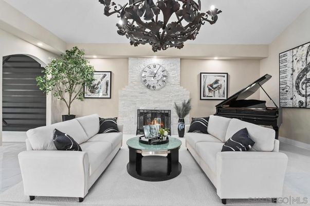 Chandelier, Fireplace, Interior, Living room, Piano, Recessed Lighting, Stone Walls