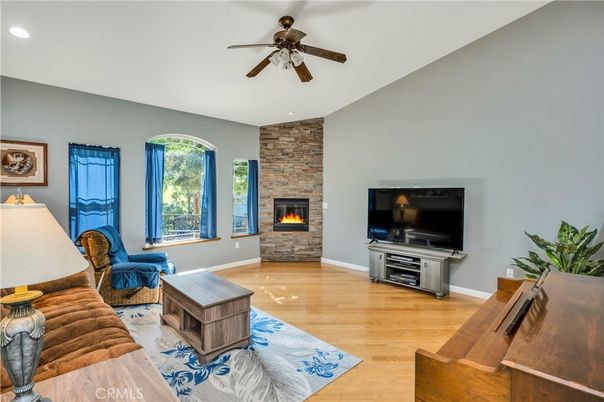 Fireplace, Interior, Living room, Recessed Lighting, Stone Walls, Wood Texture Flooring