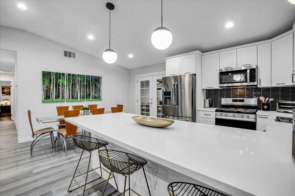 Dining room, Interior, Kitchen, Pendant Lights, Recessed Lighting, Stainless Steel Appliances, Wood Texture Flooring