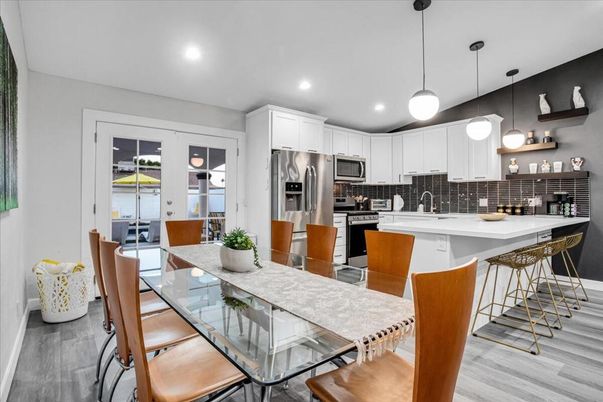 Dining room, Interior, Kitchen, Pendant Lights, Recessed Lighting, Stainless Steel Appliances, Wood Texture Flooring