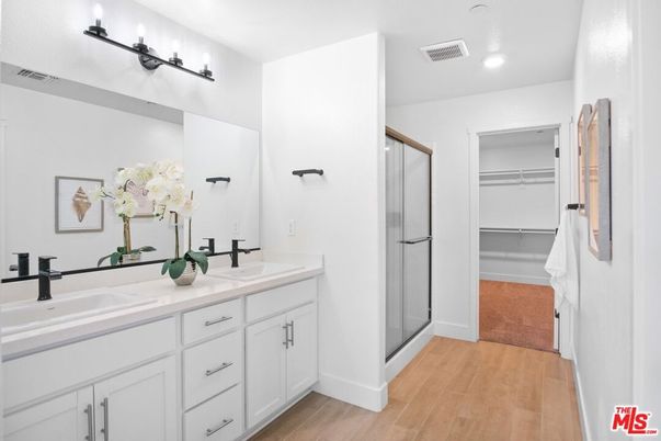 Bathroom, Dual Sink Vanities, Glass Shower, Interior, Recessed Lighting, Walk-in Closets, Wood Texture Flooring