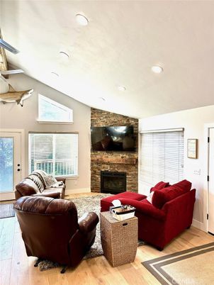 Fireplace, Interior, Living room, Recessed Lighting, Stone Walls, Wood Texture Flooring