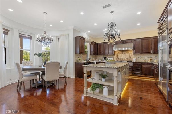 Chandelier, Dining room, Interior, Kitchen, Pendant Lights, Recessed Lighting, Stainless Steel Appliances, Wood Texture Flooring