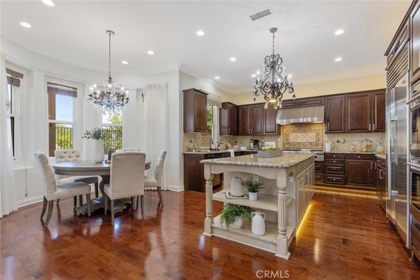 Chandelier, Dining room, Interior, Kitchen, Pendant Lights, Recessed Lighting, Stainless Steel Appliances, Wood Texture Flooring