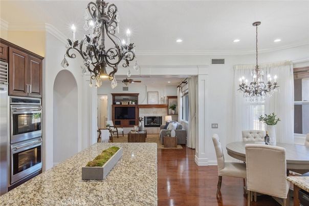 Chandelier, Dining room, Fireplace, Interior, Kitchen, Living room, Recessed Lighting, Wood Texture Flooring