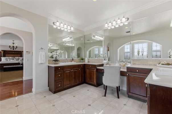 Bathroom, Chandelier, Dual Sink Vanities, Interior, Wood Texture Flooring