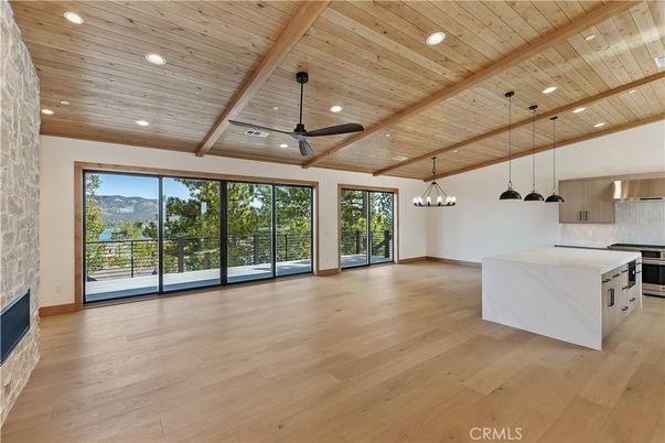 Empty room, Interior, Kitchen, Pendant Lights, Recessed Lighting, Stainless Steel Appliances, Wooden Beams, Wooden Ceilings, Wood Texture Flooring