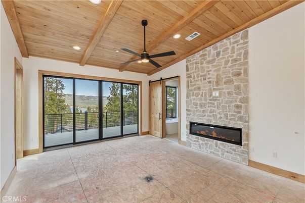 Empty room, Fireplace, Interior, Recessed Lighting, Stone Walls, Wooden Beams, Wooden Ceilings