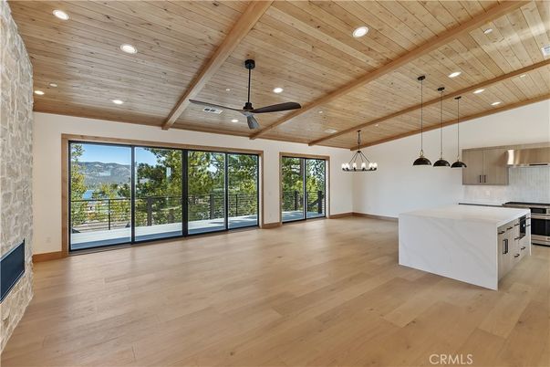 Empty room, Interior, Kitchen, Pendant Lights, Recessed Lighting, Stainless Steel Appliances, Wooden Beams, Wooden Ceilings, Wood Texture Flooring