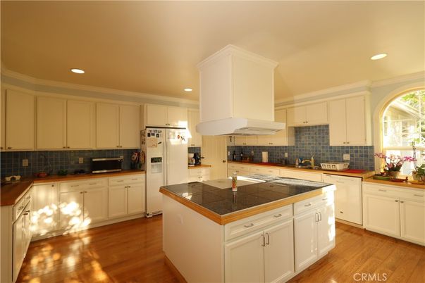 Interior, Kitchen, Recessed Lighting, Tile Countertops, Wood Texture Flooring