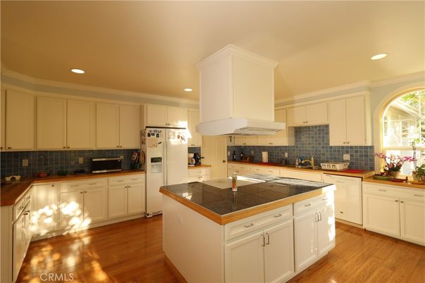 Interior, Kitchen, Recessed Lighting, Tile Countertops, Wood Texture Flooring