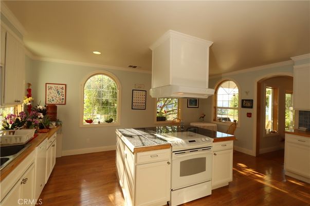 Interior, Kitchen, Recessed Lighting, Tile Countertops, Wood Texture Flooring
