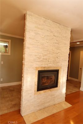 Empty room, Fireplace, Interior, Recessed Lighting, Stone Walls, Wood Texture Flooring