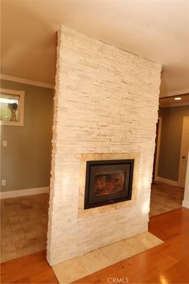 Empty room, Fireplace, Interior, Recessed Lighting, Stone Walls, Wood Texture Flooring