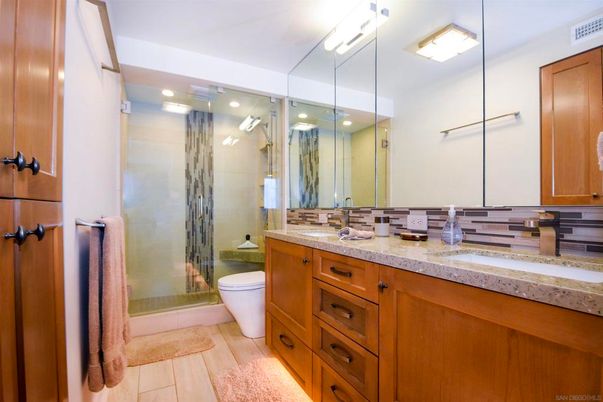 Bathroom, Dual Sink Vanities, Glass Shower, Interior, Recessed Lighting, Wood Texture Flooring