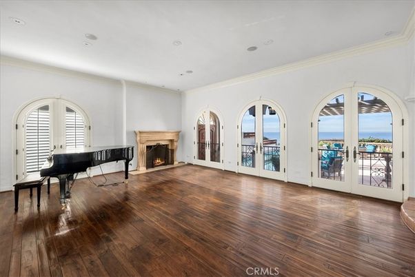 Fireplace, Interior, Piano, Recessed Lighting, Water, Wood Texture Flooring