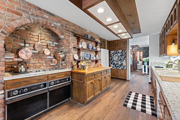 Interior, Kitchen, Recessed Lighting, Stainless Steel Appliances, Stone Walls, Tile Countertops, Wooden Beams, Wood Texture Flooring