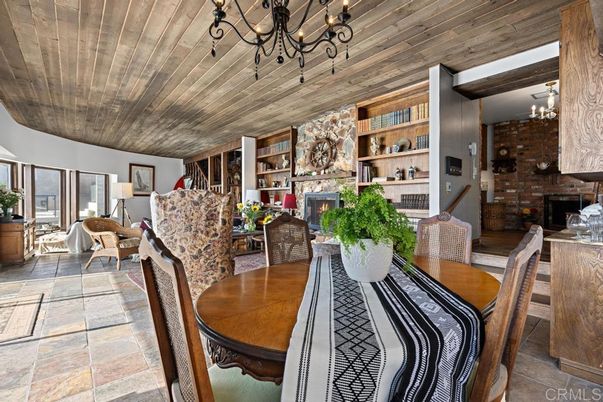 Chandelier, Dining room, Fireplace, Interior, Living room, Stone Walls, Wooden Beams, Wooden Ceilings