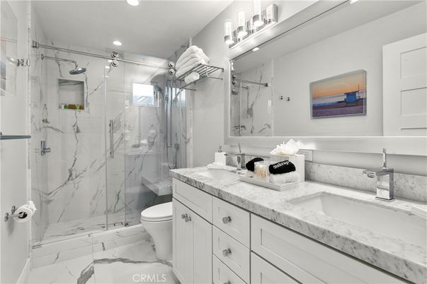 Bathroom, Dual Sink Vanities, Glass Shower, Interior, Marble, Marble Walls, Recessed Lighting
