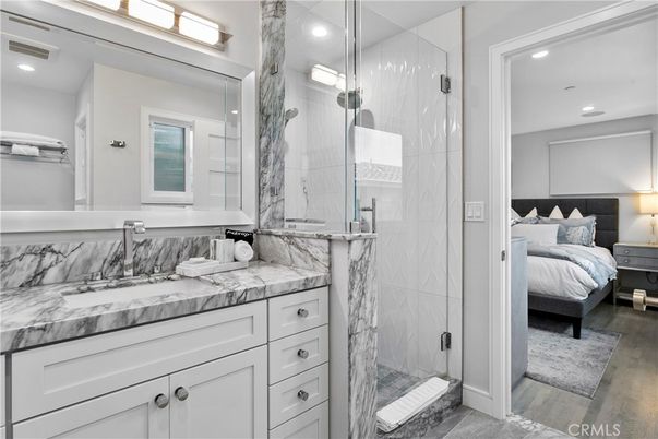 Bathroom, Bedroom, Glass Shower, Interior, Marble Walls, Recessed Lighting, Wood Texture Flooring