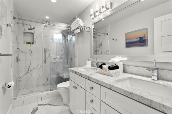 Bathroom, Dual Sink Vanities, Glass Shower, Interior, Marble, Marble Walls, Recessed Lighting