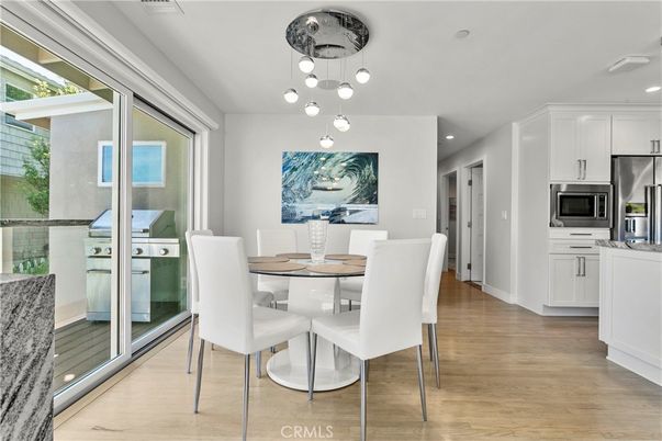 Dining room, Interior, Kitchen, Pendant Lights, Recessed Lighting, Stainless Steel Appliances, Wood Texture Flooring